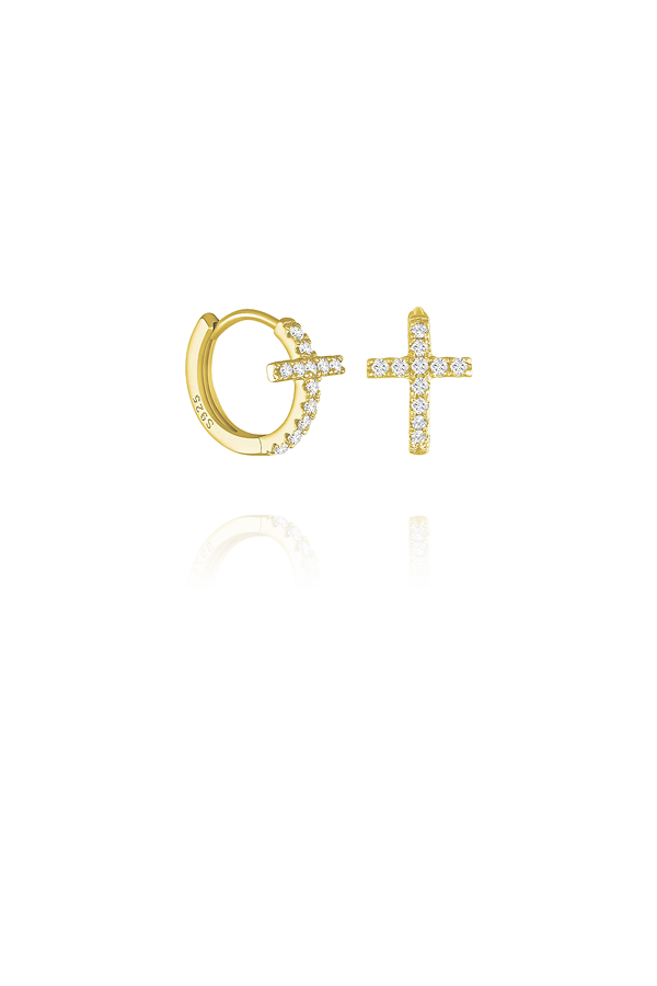 A pair of dainty gold cross huggies without background on display.