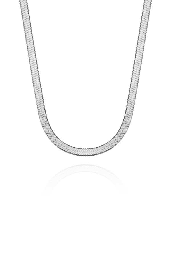 A standalone image of a shiny silver herringbone chain necklace, gracefully draped in a U-shape, presented on a plain white background with a reflection below.