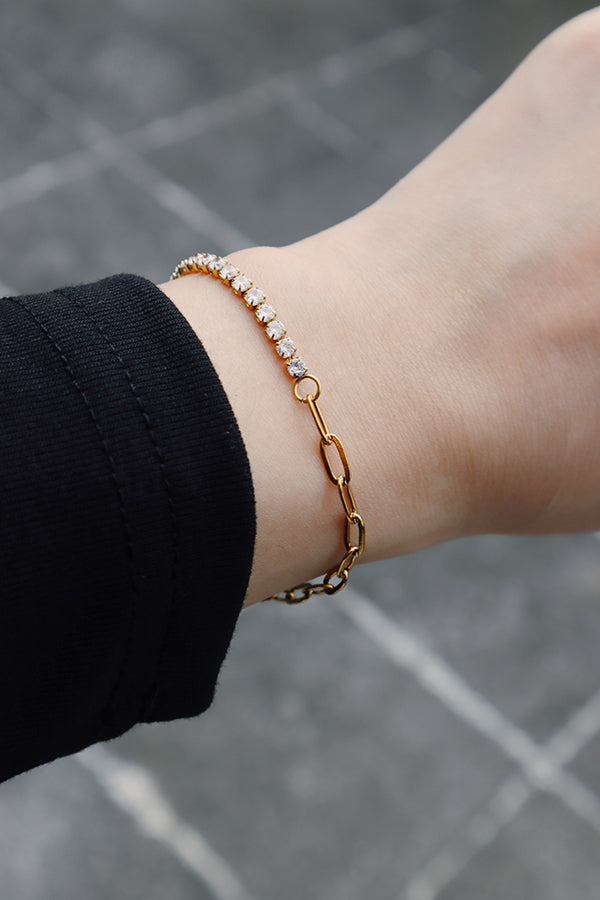 Gold tennis chain bracelet reflecting natural light, ideal for everyday wear.