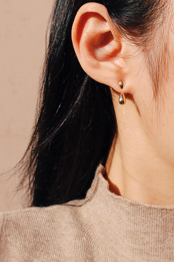 Lightweight and versatile gold teardrop earrings, styled solo or as a dangle for a clean and fashionable look.