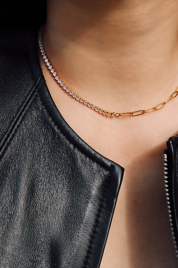 Gold half-set zircon choker necklace resting along the collarbone with subtle sparkle.