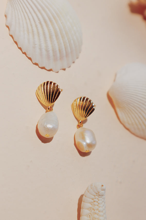 Kyra Pearl Drop Earrings, perfect for a beach day or summer vacation.