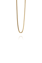 A silm gold cube chain choker without background on display