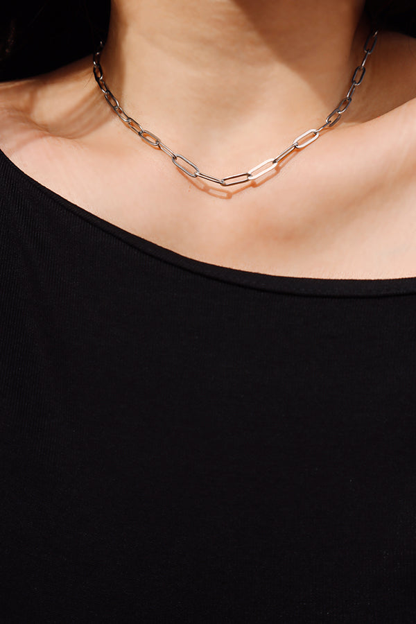 Front view of a silver paperclip chain necklace featuring sleek elongated links for everyday wear.