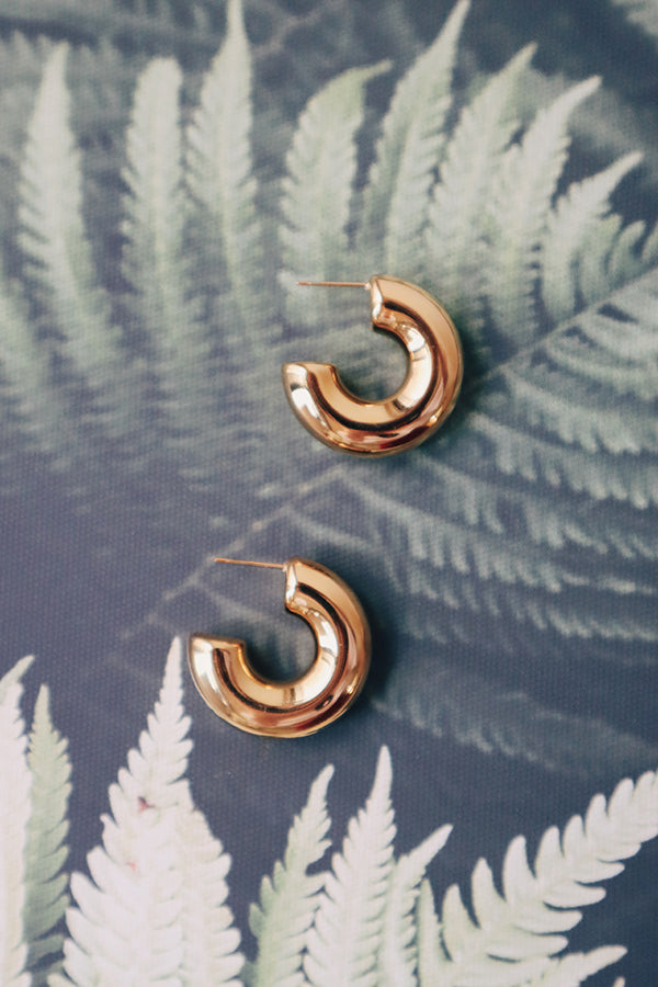 Simple and bold gold hoops, a water-resistant and hypoallergenic choice for woman.