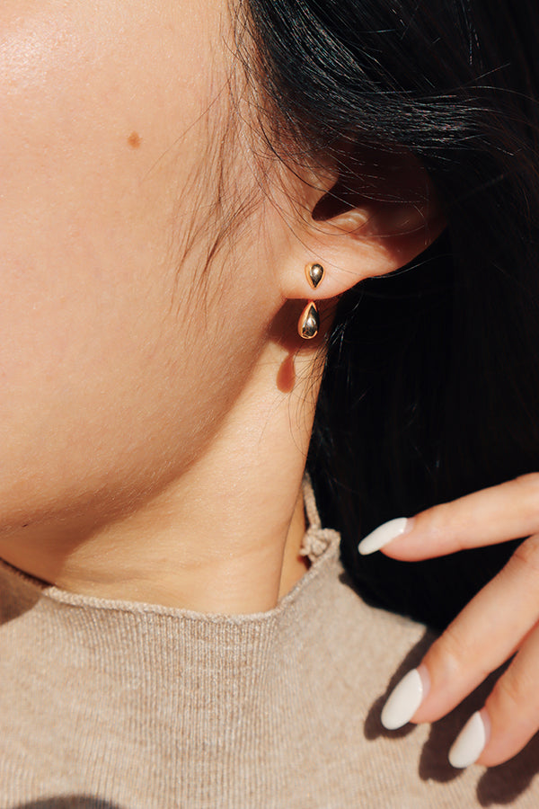 Sleek two-part gold drop earrings embracing modern minimalism—versatile for both everyday and dressy looks.