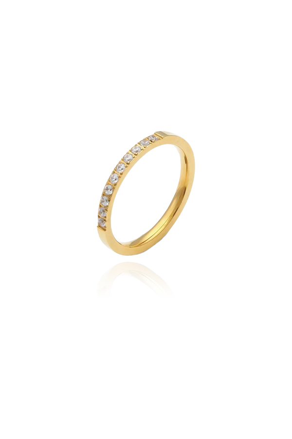 A product image of a thin gold ring with a row of cubic zirconia stones along the band. The ring's slim design and sparkling stones make it a perfect accessory for stacking or wearing as a delicate, elegant piece on its own.