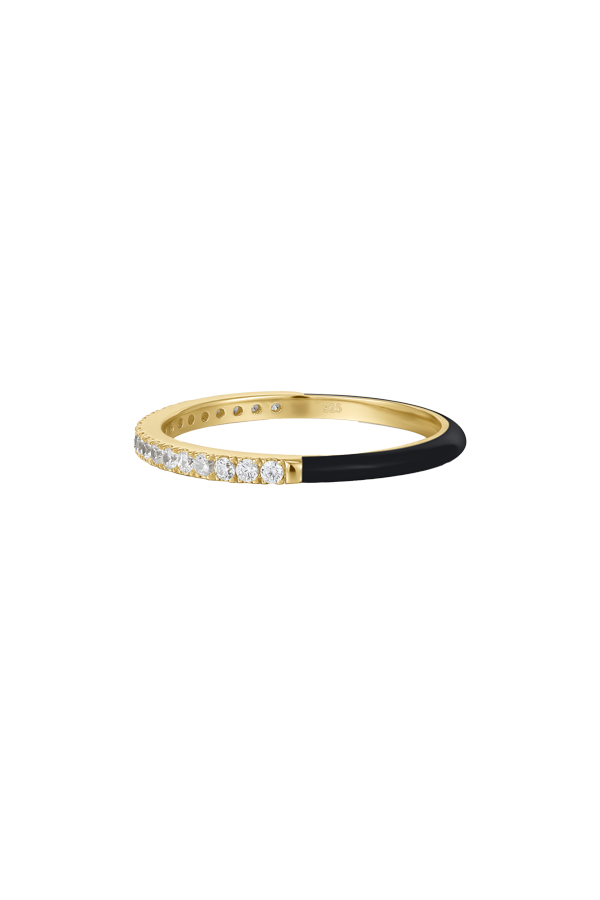 A standalone image of a slim gold ring that is half adorned with a row of clear cubic zirconia stones and half covered in smooth black enamel, presented on a white background.