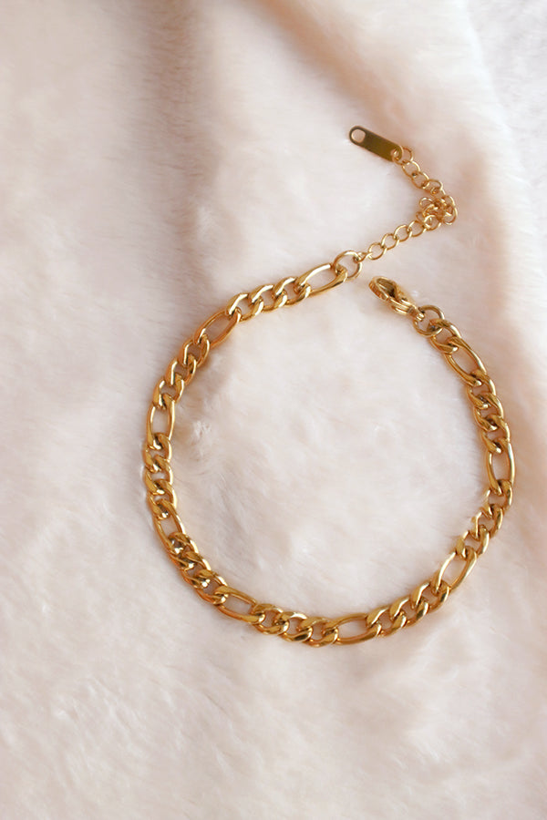 Figaro bracelet on the white blanket