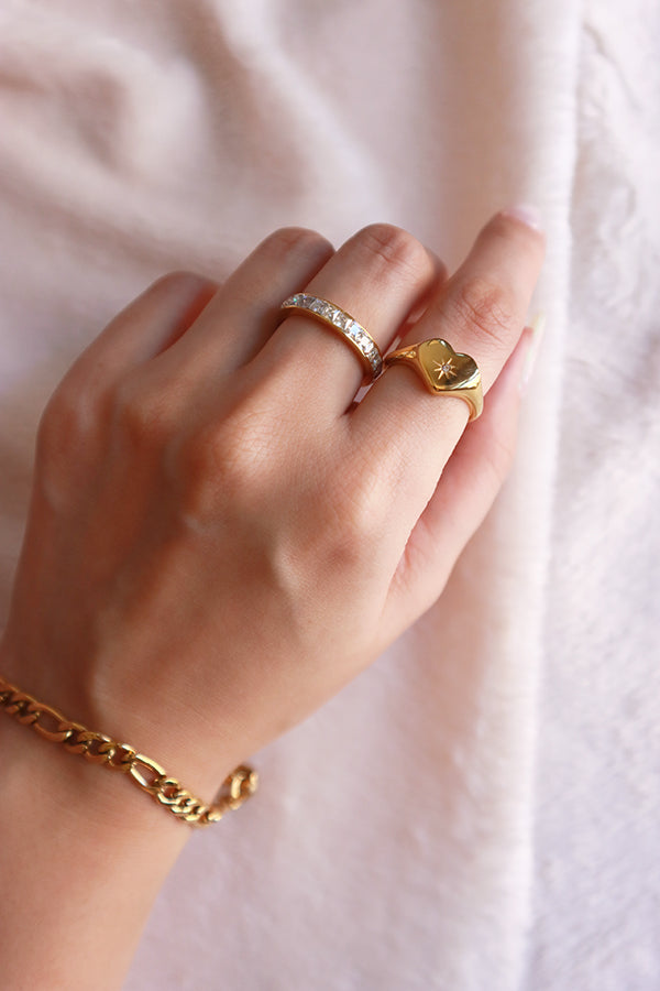 18k gold plated rings on the model's left hand
