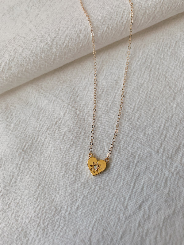 Small gold heart shape necklace with opal in the middle from USA