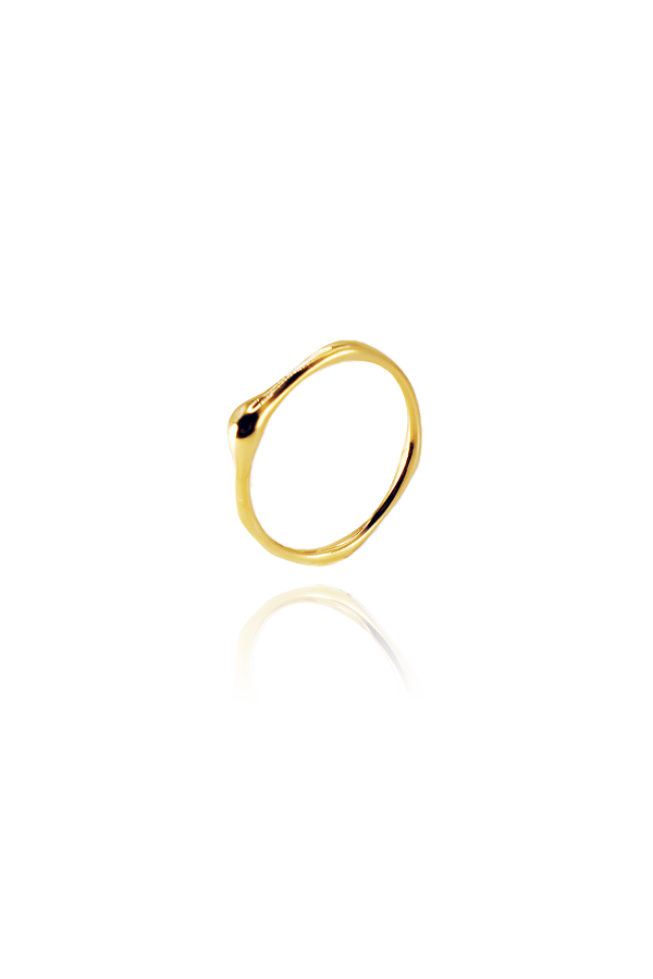 A single dainty gold ring with a subtle wavy or organic shape, shown as a product shot without background.