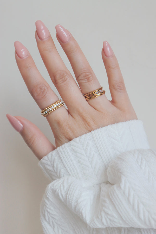 Stylish gold band adorned with radiant cubic zirconia stones, perfect for any occasion.