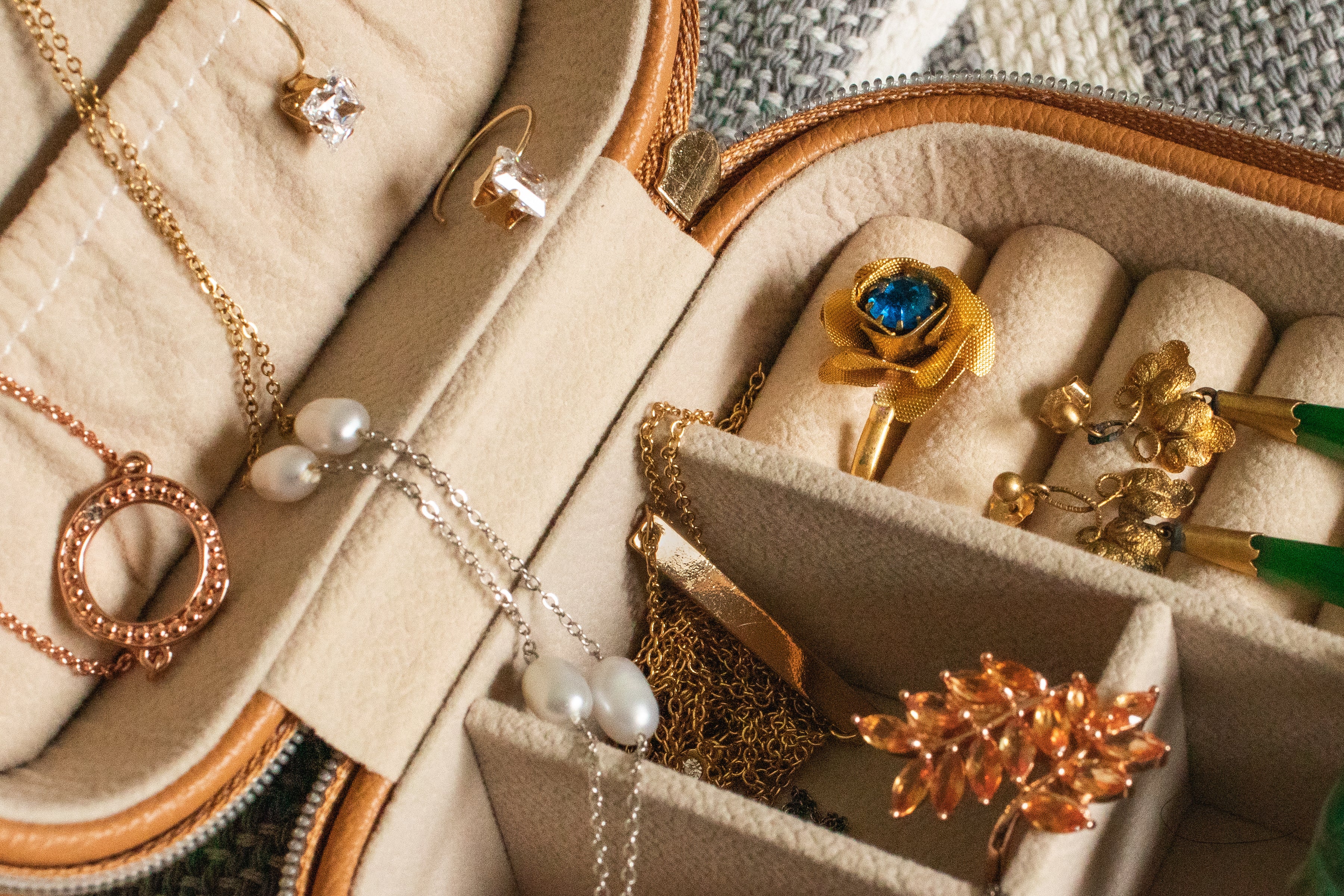 a lot of different jewelry in box