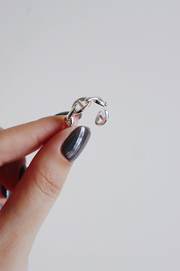 925 silver plated adjustable open ring made of brass, featuring a flexible band for size adjustment.