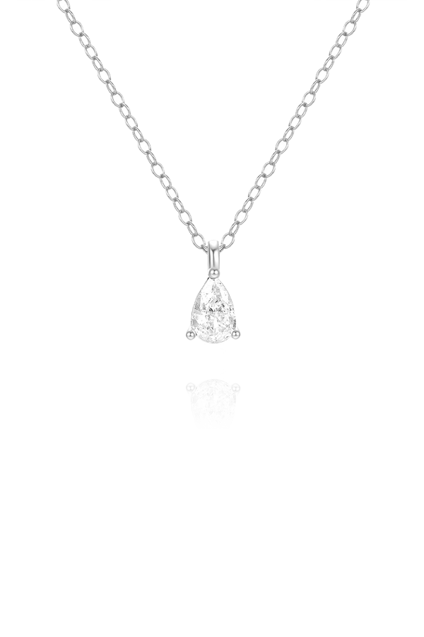 A standalone image of a delicate silver chain necklace with a single pear-cut clear diamond or cubic zirconia pendant. The necklace is displayed vertically on a white background with a reflection below.