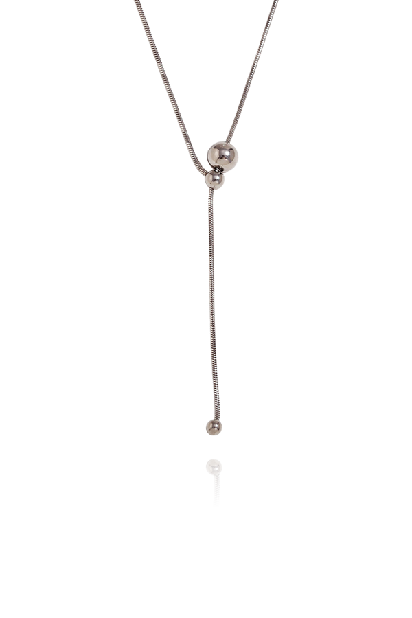 A standalone image of a long, delicate silver lariat necklace with a sliding bead that allows for adjustable length and a small bead at the end of the drop. The necklace is displayed vertically on a white background with reflections.