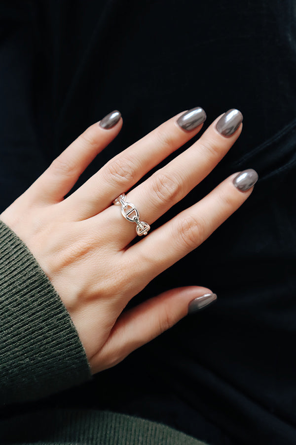 Adjustable silver open band ring with clean modern lines, perfect for everyday styling.