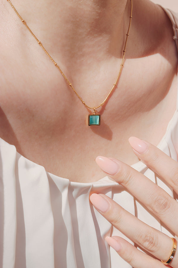 Canal blue cat's eye pendant necklace adds a vibrant touch