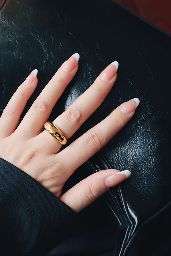 Woman wearing a fashion trend dome gold ring