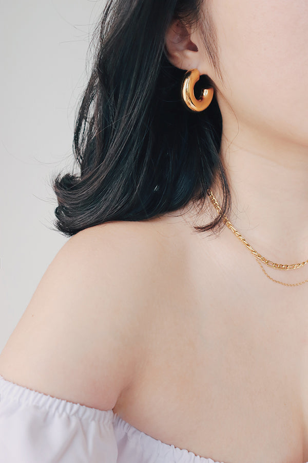 Girl wearing gold hoops to making a bold statement from day to night