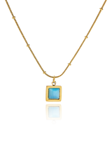 Closeup of the captivating blue cat's eye stone on Erin Necklace