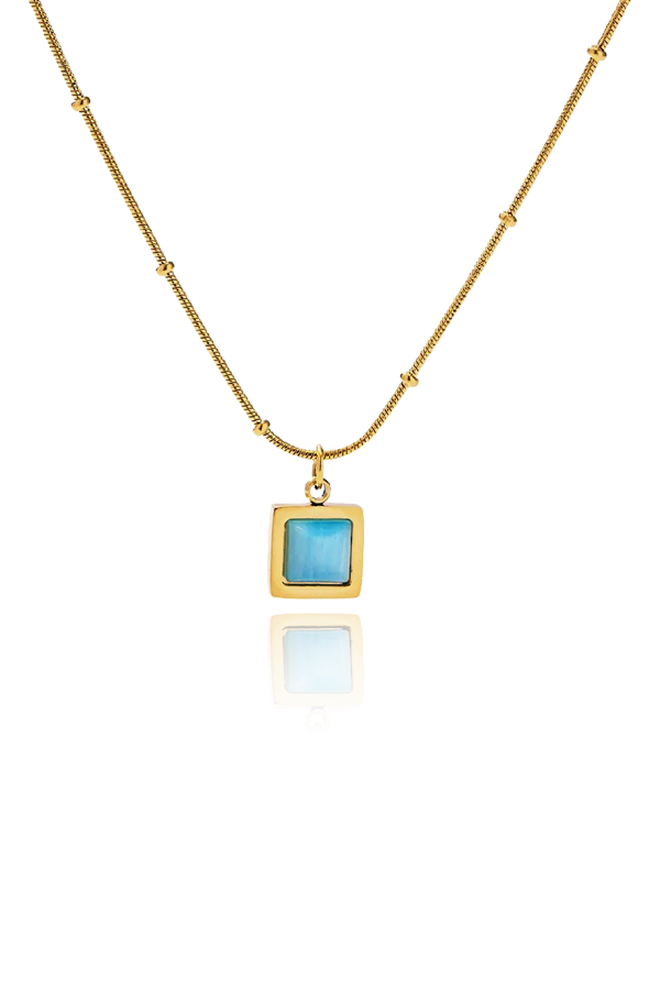 Closeup of the captivating blue cat's eye stone on Erin Necklace