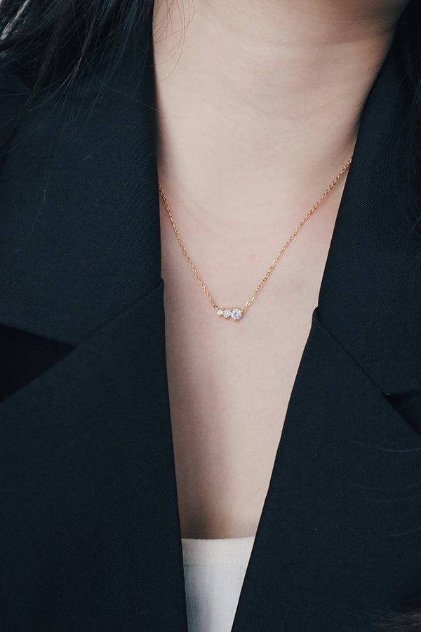 Business professional woman wearing a elegant shinny cz necklace