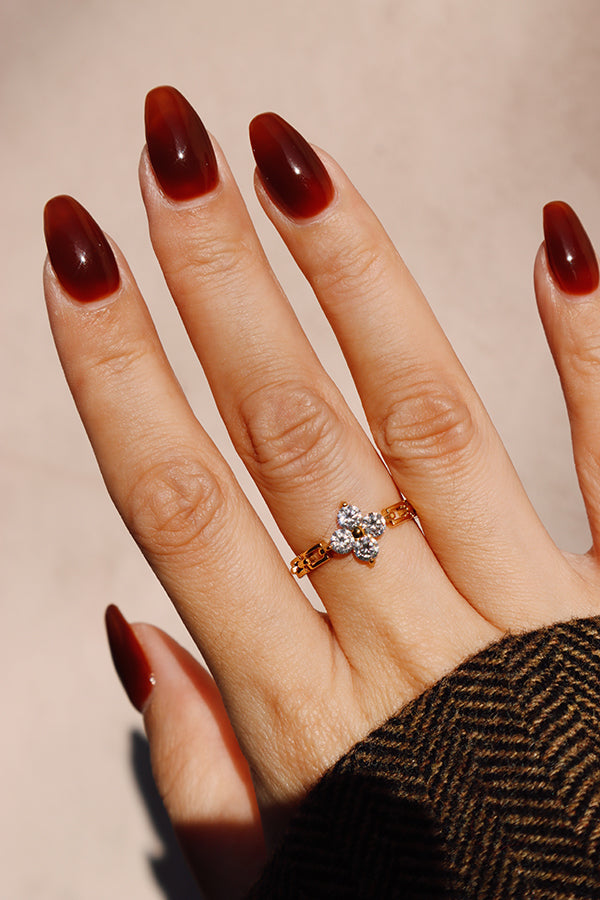 Liana Flora dainty gold flower ring worn alone, perfect for everyday outfits or romantic styling.