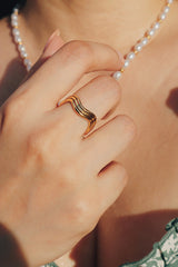 Woman wearing nina weave ring for a dainty and simple look
