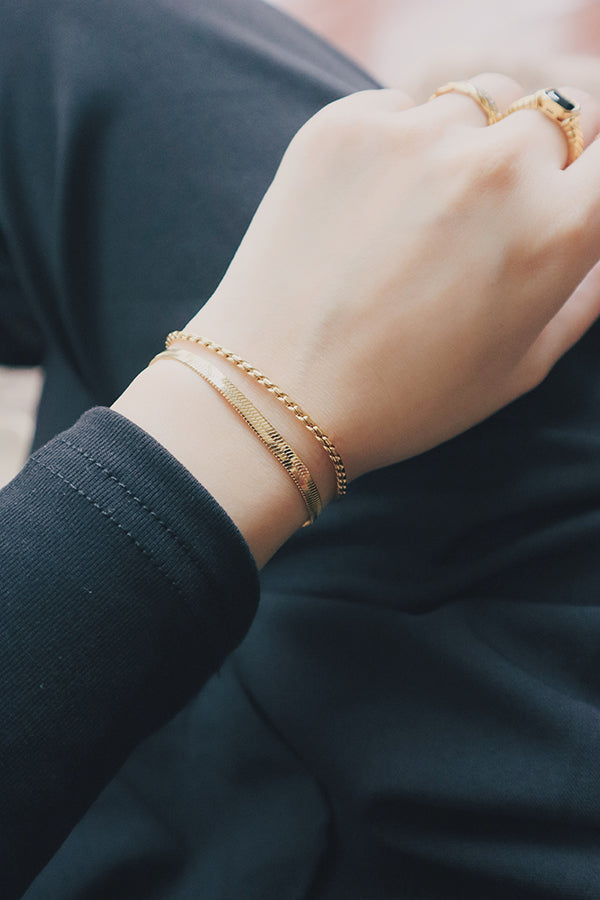 Model showing her layering bracelet look to camera