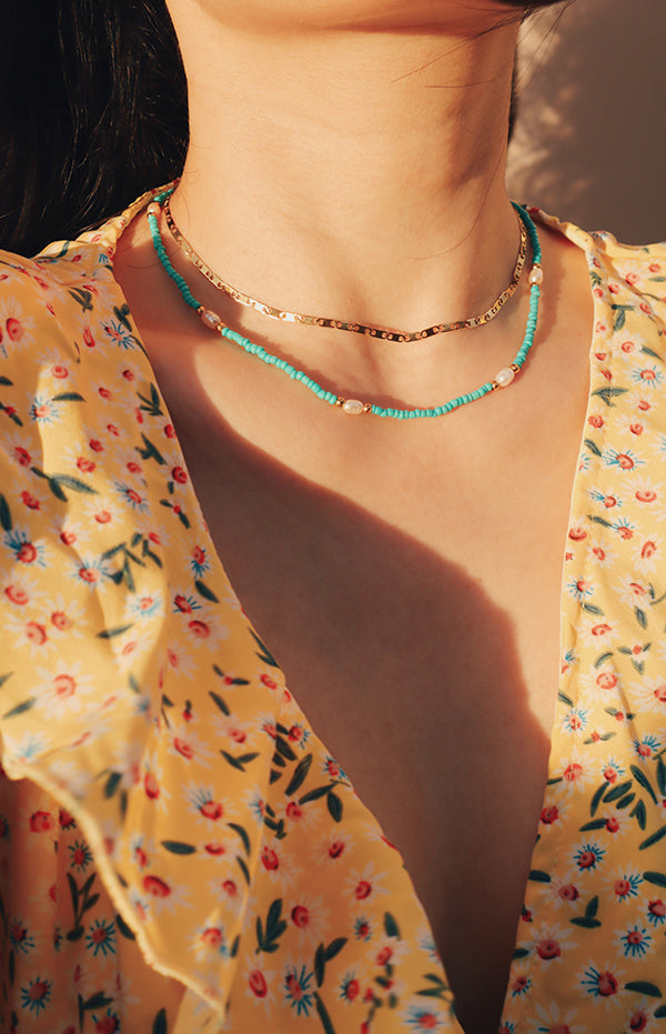 Woman displaying layered look with Ciera Boho Bead Choker