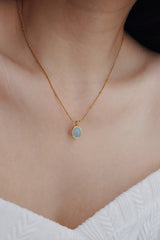Model wearing waterproof necklace for the summer pool party