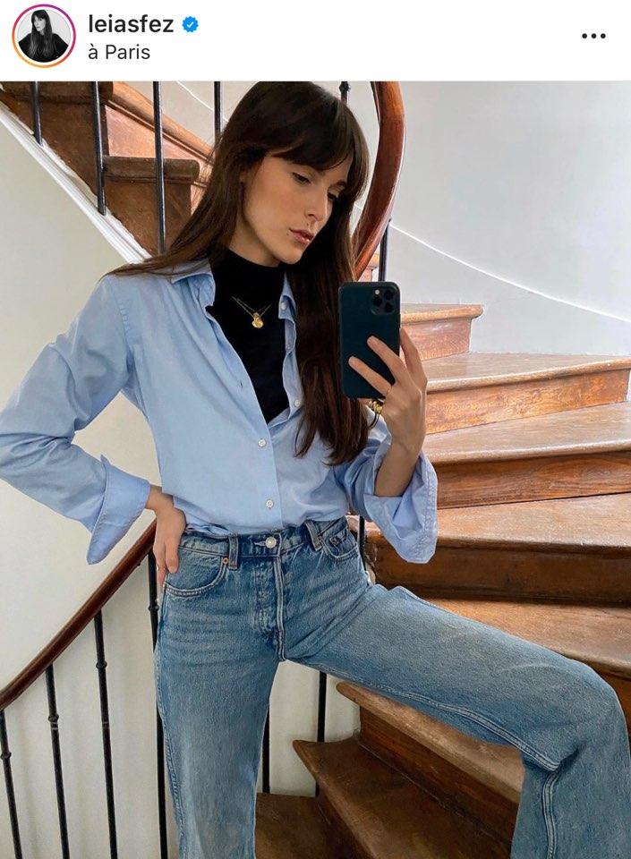 Blue shirt European girl with turtle neck wears gold necklace