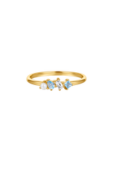 Three different types of gemstones on a slim gold ring 