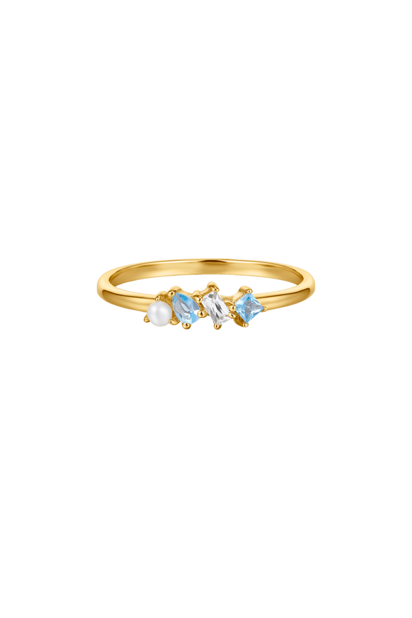 Three different types of gemstones on a slim gold ring 