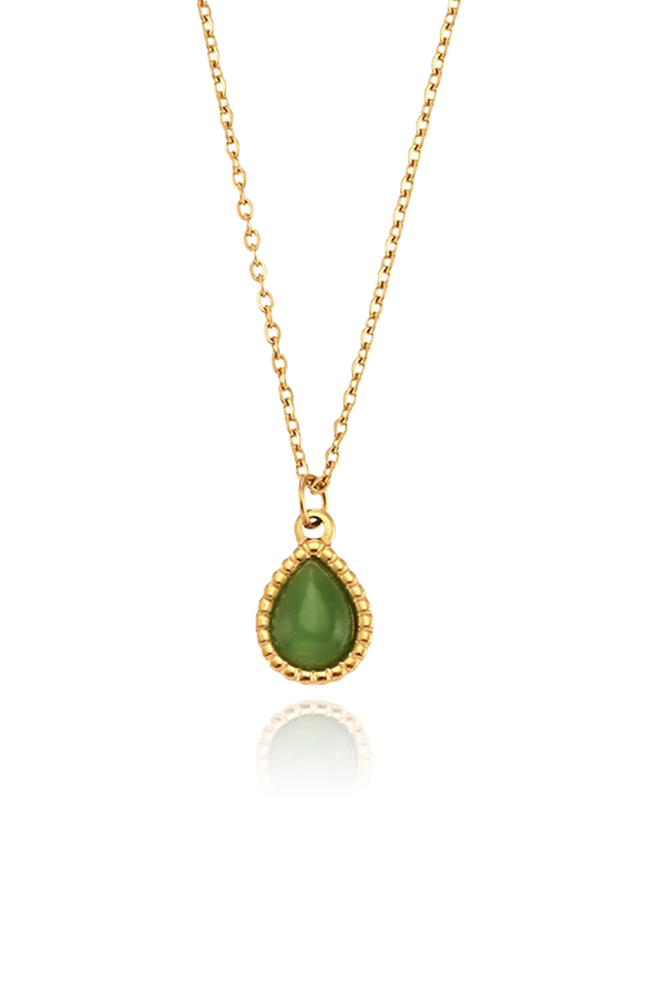 Product image of the Ava cat's eye charm necklace in green, featuring a teardrop-shaped pendant with a beaded gold frame, displayed on a white background.