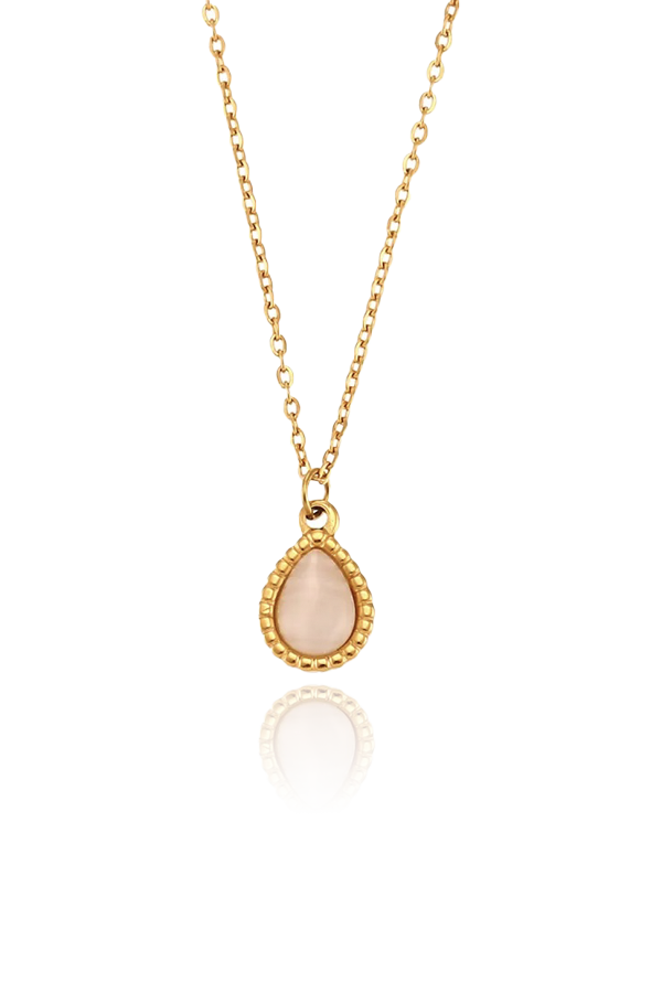 Product image of the Ava cat's eye charm necklace in white, featuring a teardrop-shaped pendant with a beaded gold frame, displayed on a white background.