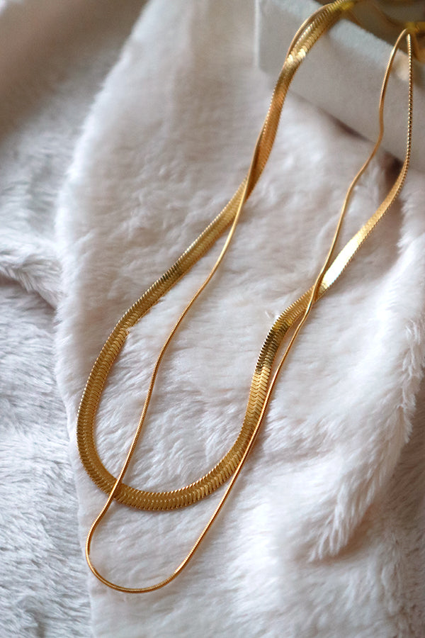 Everyday basic gold necklace on white blanket