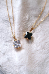 Hypoallergenic material black and white rhinestone necklaces on white cloth