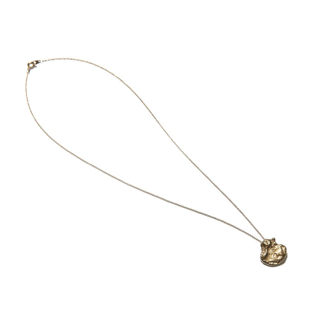 Crumpled gold necklace without background