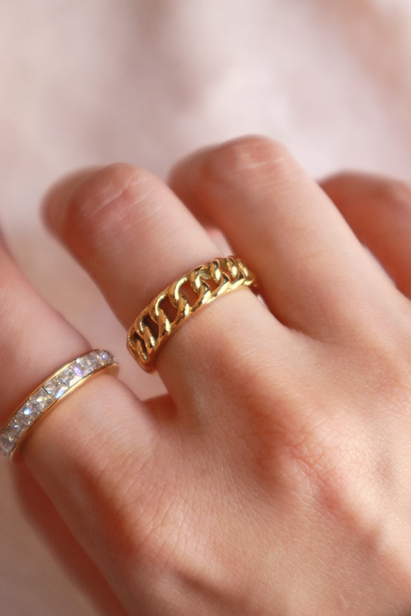 Woman created a stacking style with SH&Co.'s jewelry