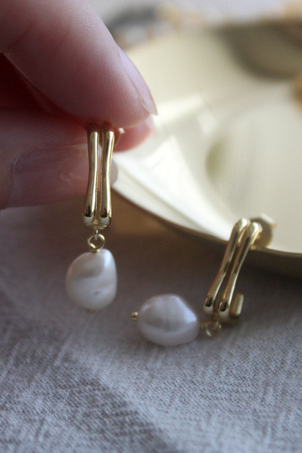 Gold pearl drop earrings from SH & Co.