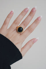 Model in black dress wearing tarnish free gold plated jewelry 