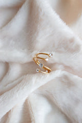 Layered cz gold ring on the white blanket