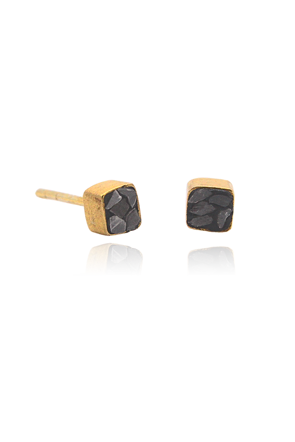 A pair of black diamond square studs on display from SH & Co. Jewelry