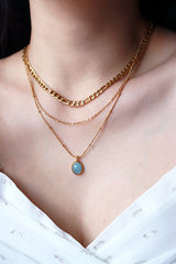 Asian model wearing gold plated layered necklace