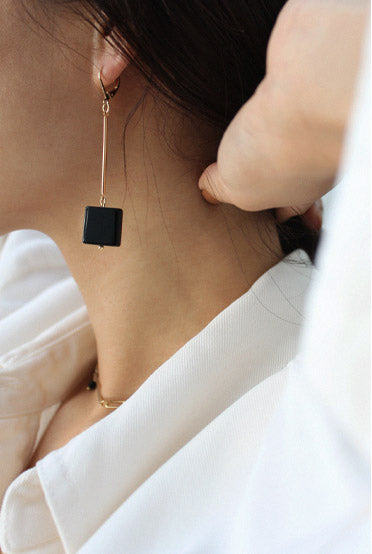 Side profile of a black onyx earrings
