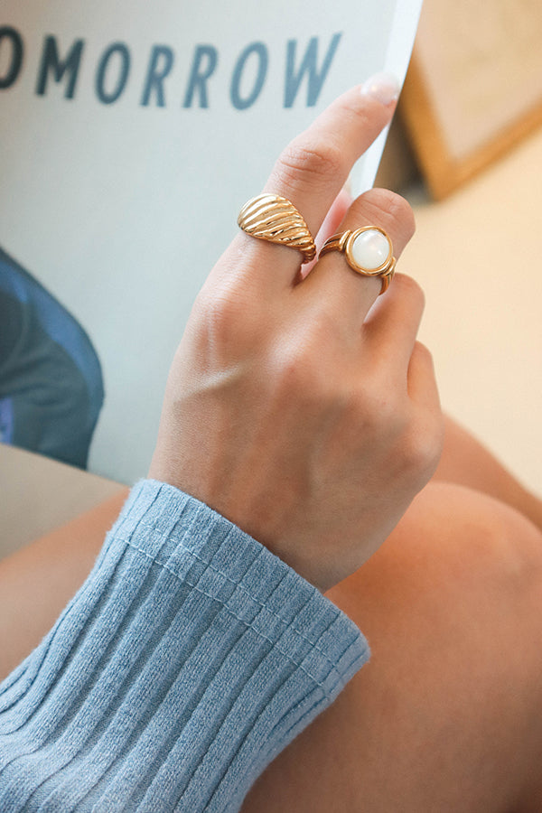 Model wearing stainless steel gold plated jewelry on her right hand