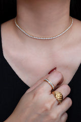 Model wearing the luxury rhinestone choker and beautiful gold rings